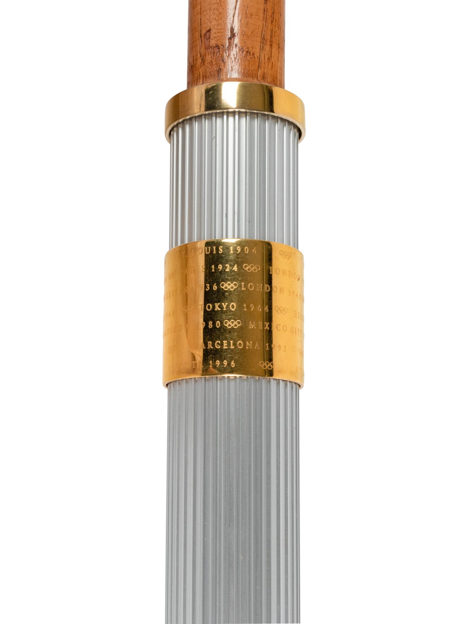 A 1996 Atlanta Olympics Torch and Assorted Relay Used Items by 1964 United States Basketball Team Gold Medal Winner George Wilson,