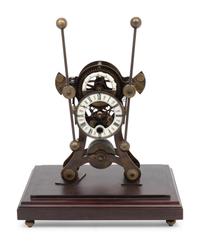 A Continental Cased Brass Skeleton Clock