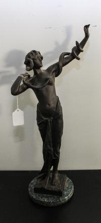 A Continental Bronze Snake Charmer Height overall 18 inches.
