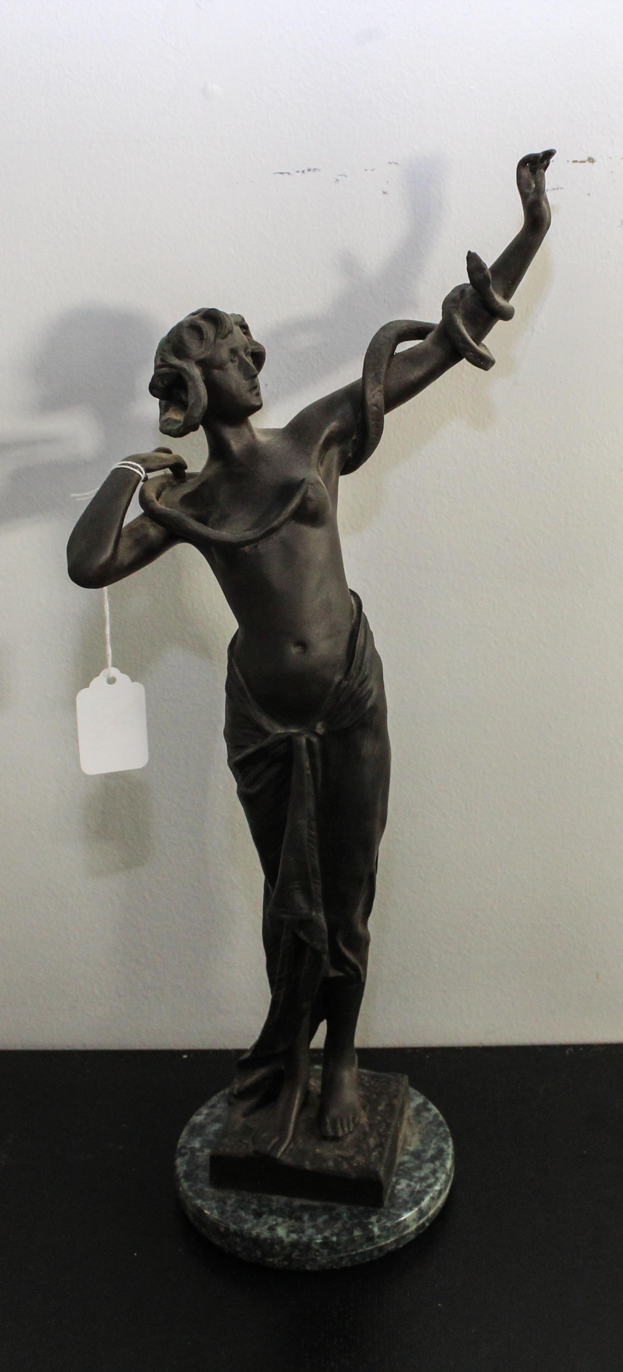 A Continental Bronze Snake Charmer Height overall 18 inches.