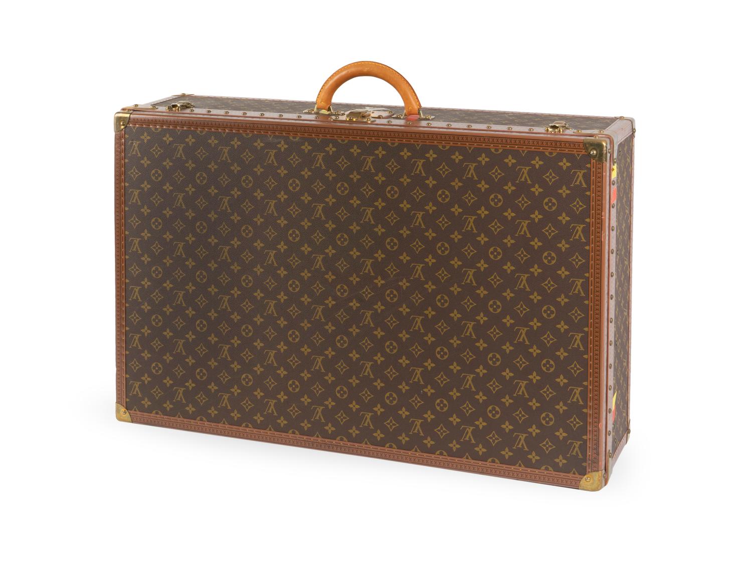 A Louis Vuitton Monogram Canvas Hardside Suitcase. — 20TH CENTURY