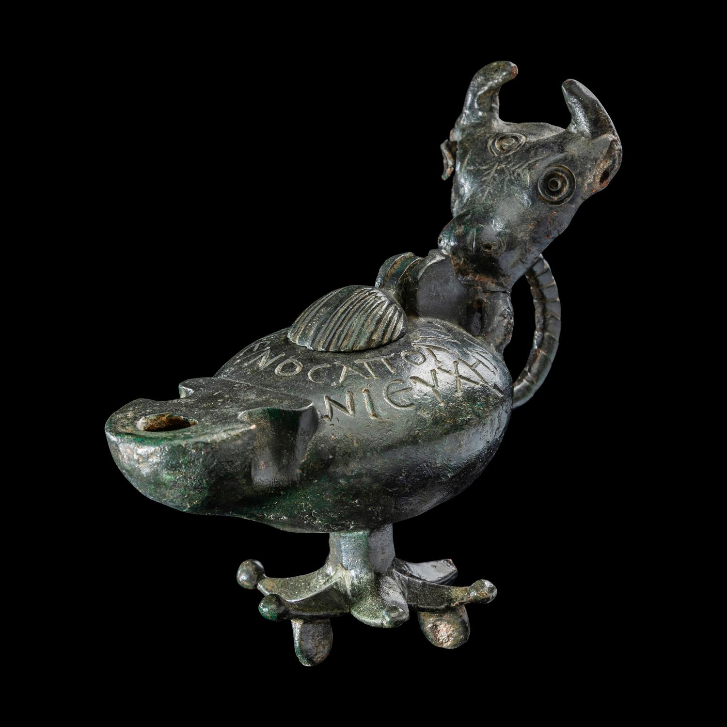 A Late Roman Bronze Lamp with Bull Head Handle and Greek Inscription