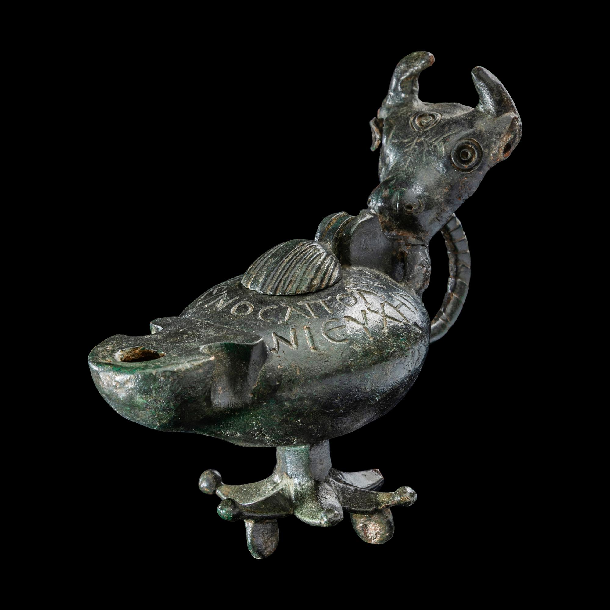 A Late Roman Bronze Lamp with Bull Head Handle and Greek Inscription