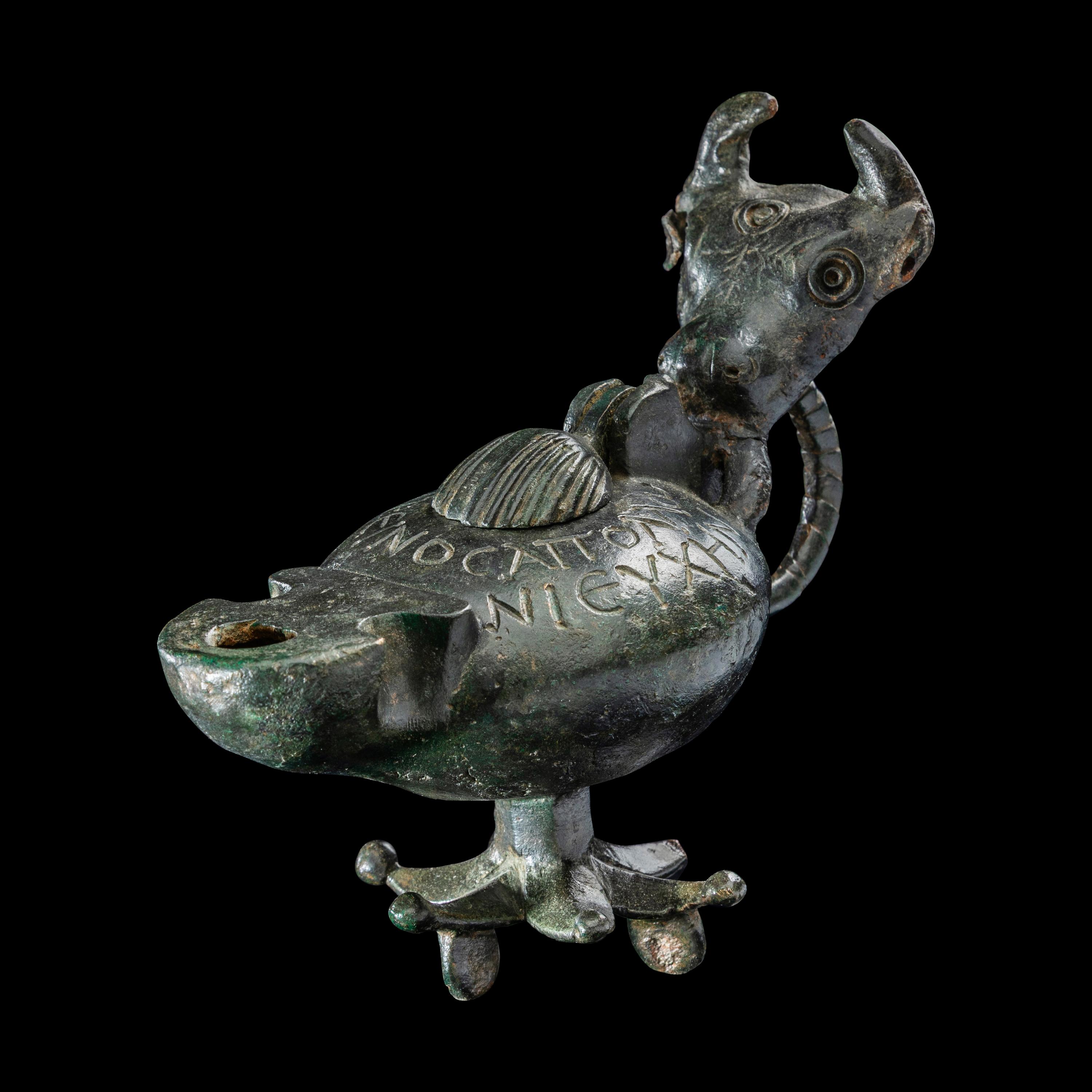 A Late Roman Bronze Lamp with Bull Head Handle and Greek Inscription