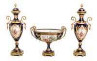 A Sevres Style Gilt Bronze Mounted Porcelain Garniture Height of urn 12 3/8 inches. — 19TH CENTURY