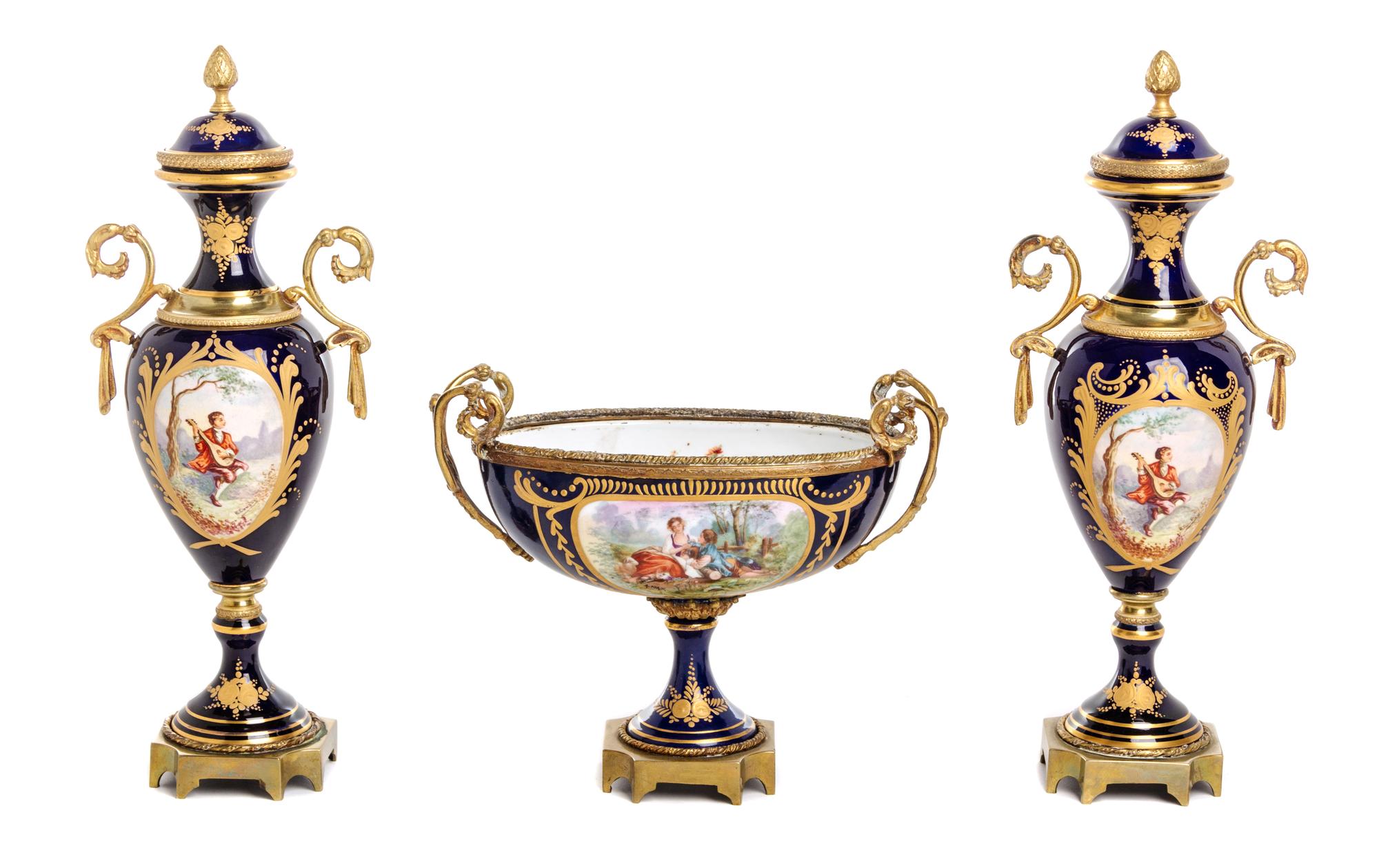 A Sevres Style Gilt Bronze Mounted Porcelain Garniture Height of urn 12 3/8 inches. — 19TH CENTURY