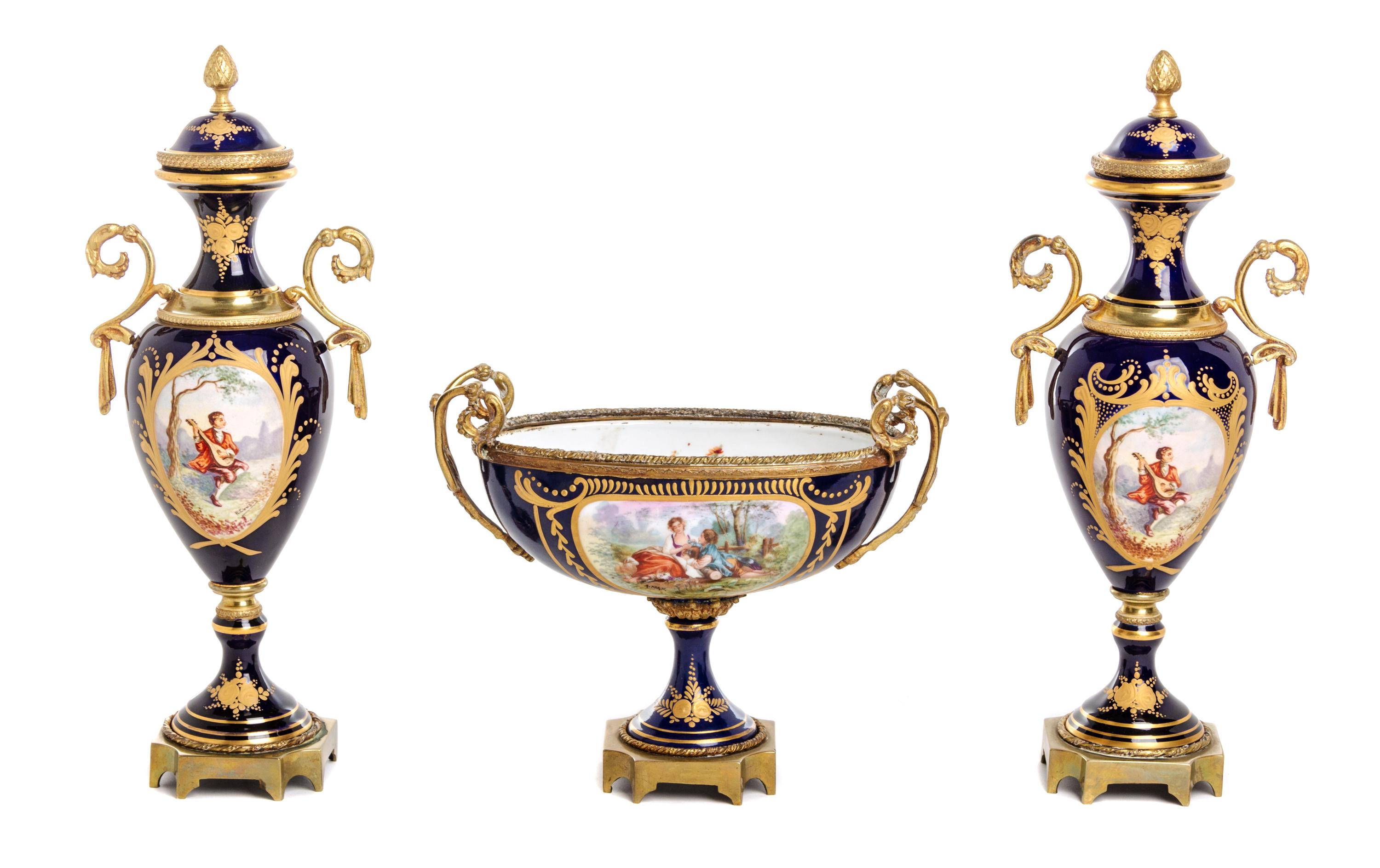 A Sevres Style Gilt Bronze Mounted Porcelain Garniture Height of urn 12 3/8 inches. — 19TH CENTURY