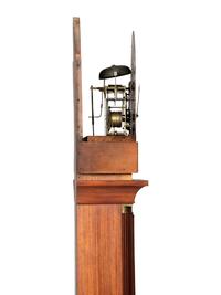 A Federal Carved and Inlaid, Brass-Mounted Mahogany Tall Case Clock
