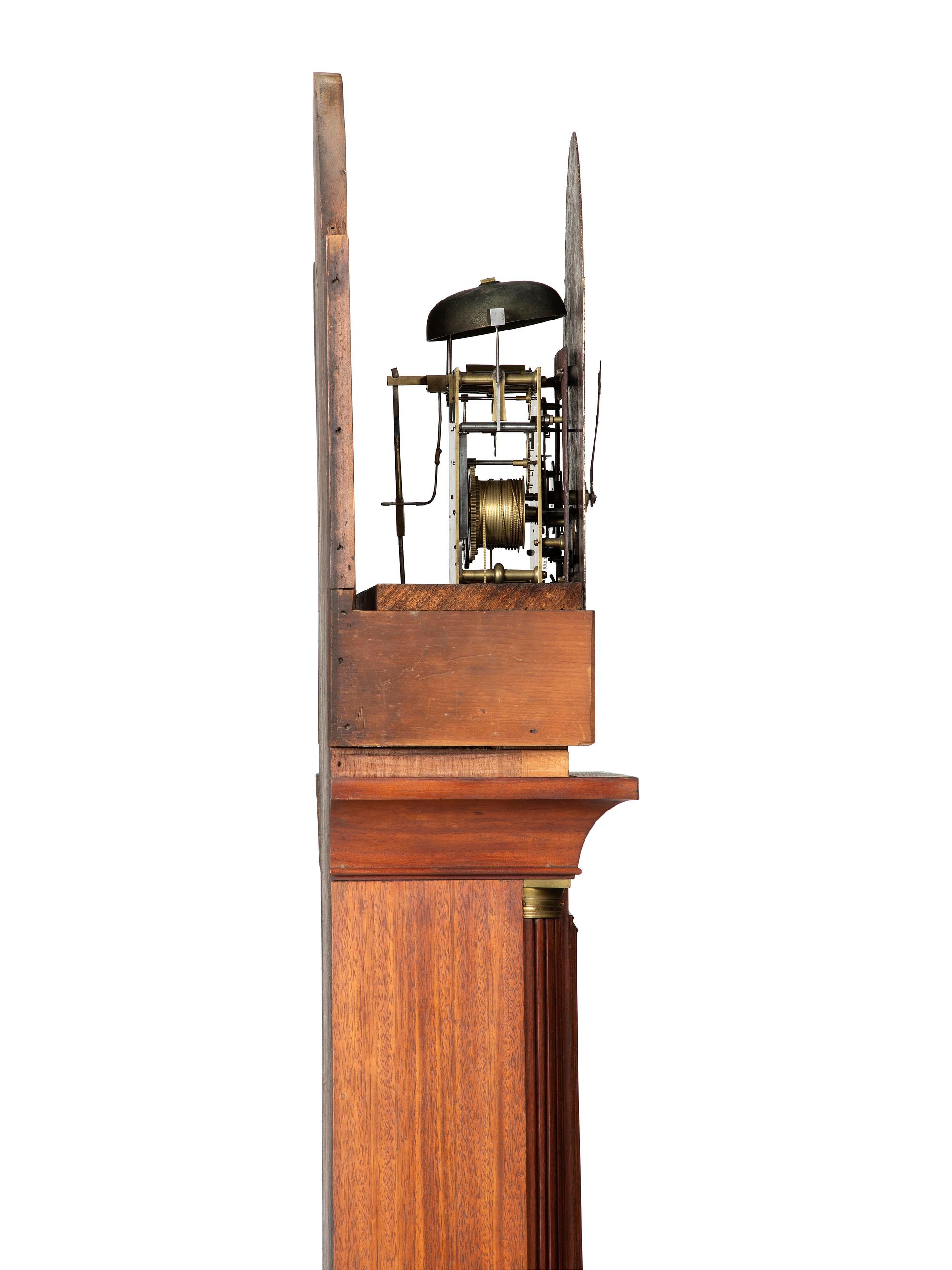 A Federal Carved and Inlaid, Brass-Mounted Mahogany Tall Case Clock