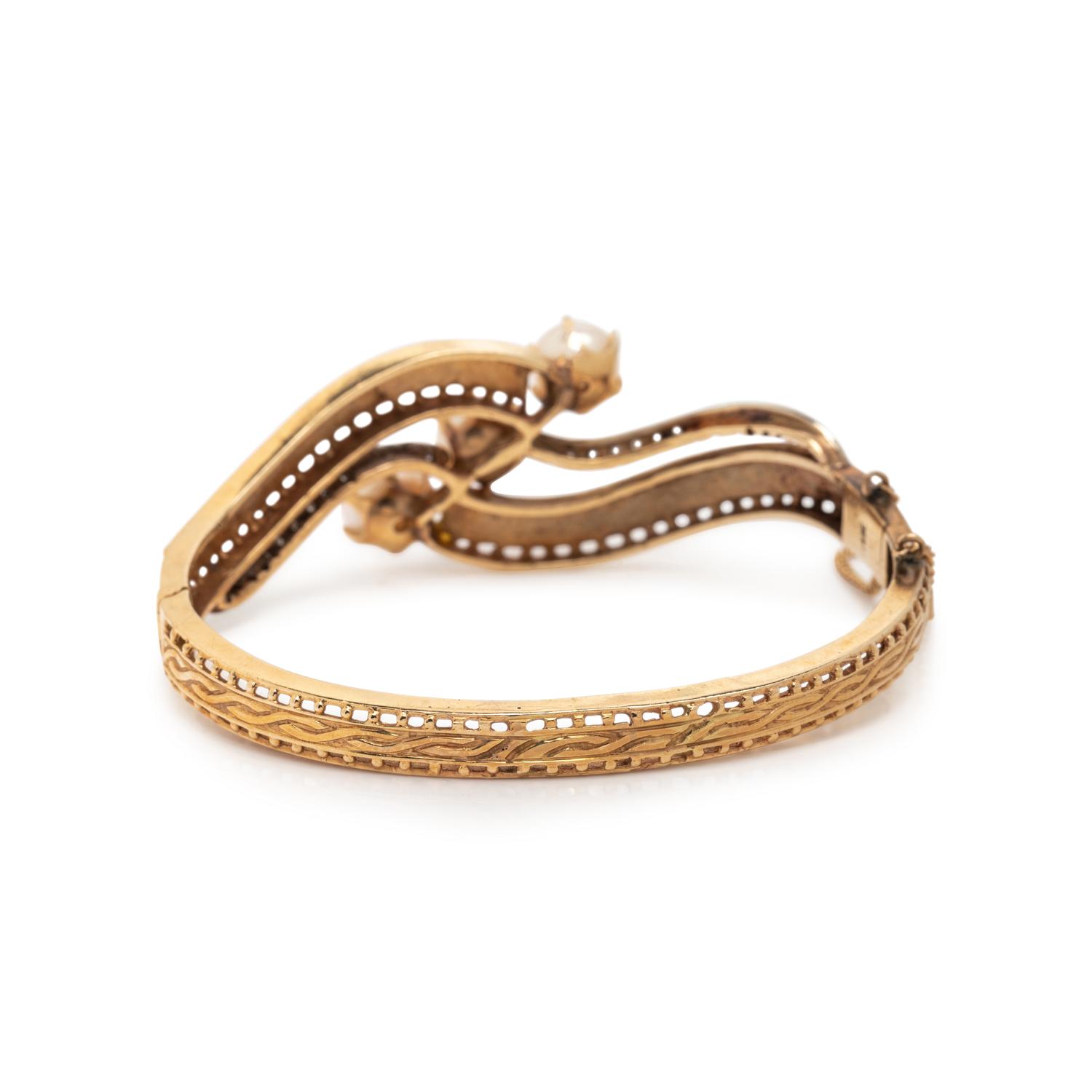 YELLOW GOLD, DIAMOND, AND CULTURED PEARL BANGLE BRACELET