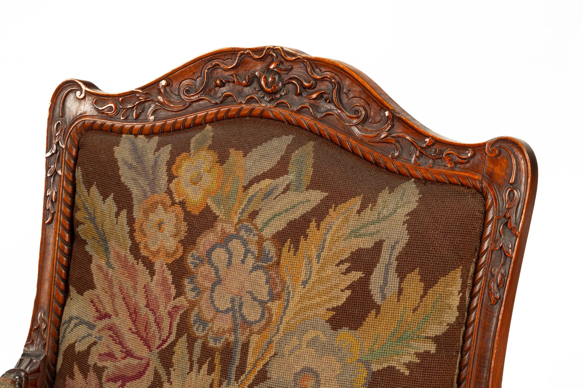 A Pair of Régence Style Carved Walnut Fauteuils