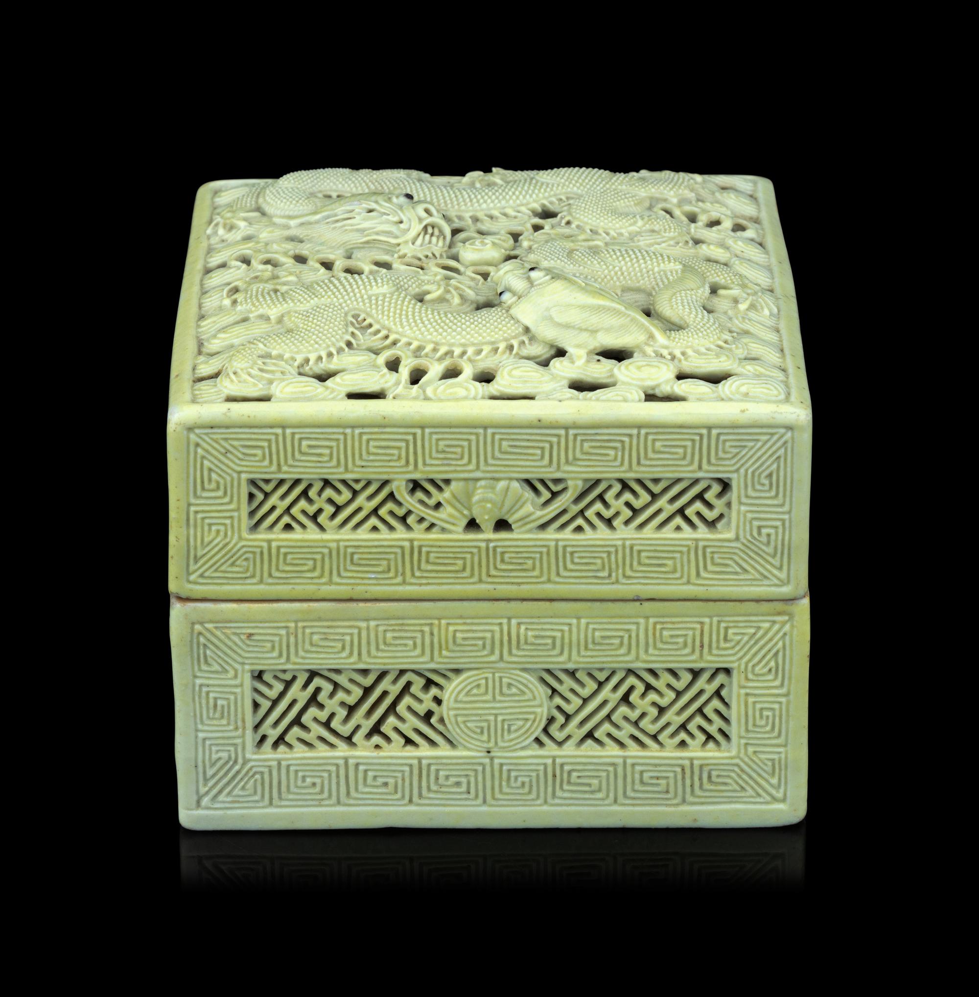 A Carved and Molded Pale Lime Glazed Porcelain 'Dragons' Seal Paste Box and Cover