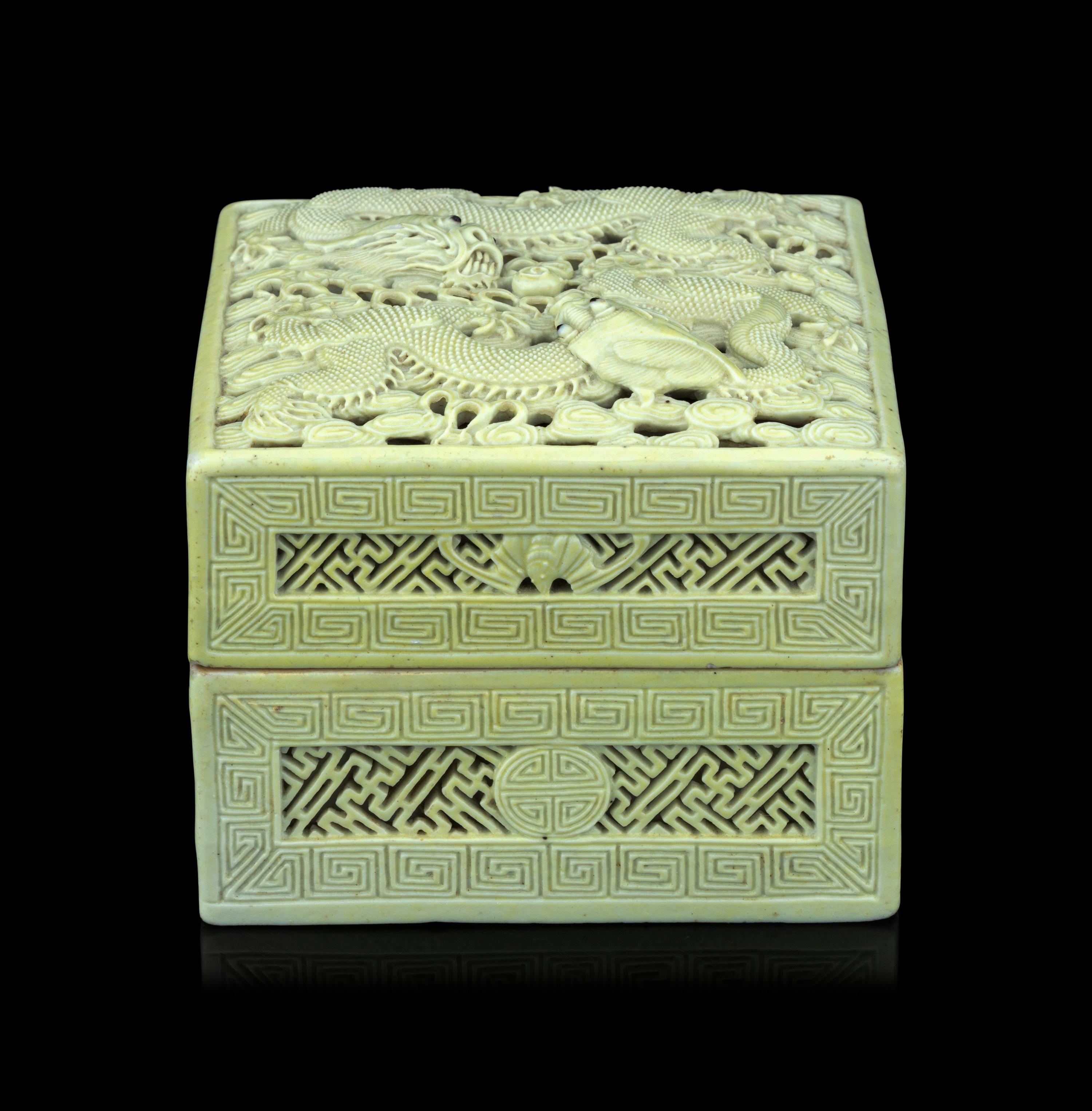 A Carved and Molded Pale Lime Glazed Porcelain 'Dragons' Seal Paste Box and Cover