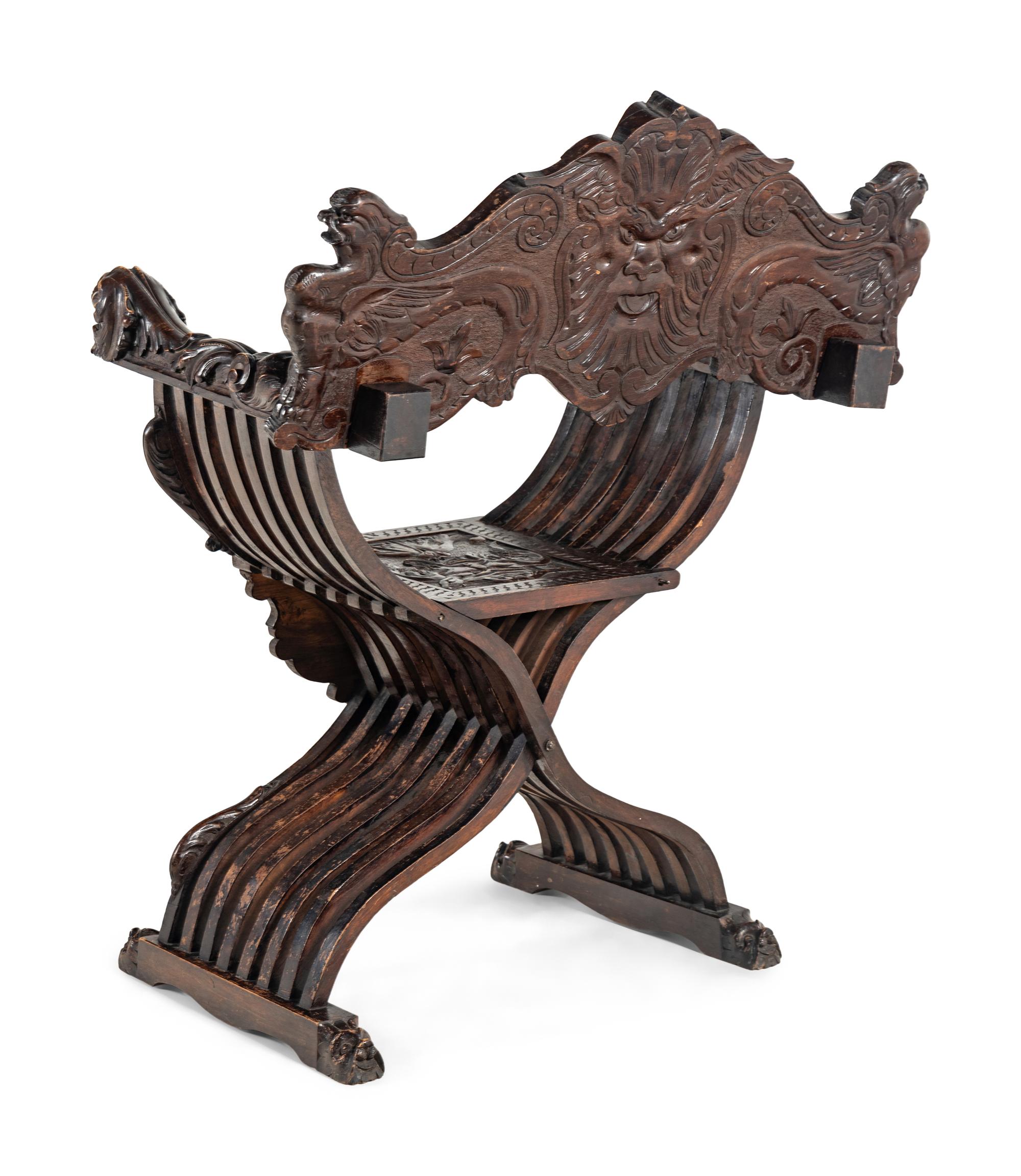 An Italian Renaissance Revival Carved Walnut Savonarola Armchair