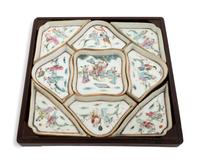 A Chinese Nine-Piece Famille Rose 'Lady' Porcelain Sweet Meat Set