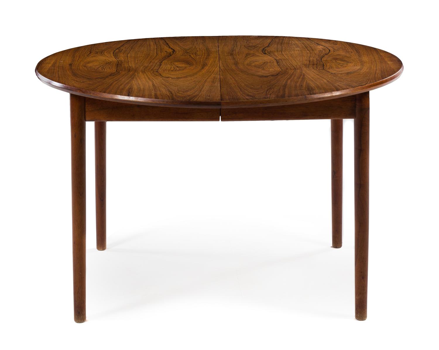 A Circular Danish Teak Dining Table, with three leaves — 1960s