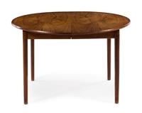 A Circular Danish Teak Dining Table, with three leaves — 1960s