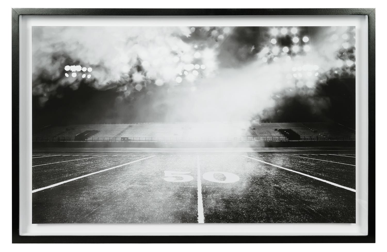 A Group of Four Framed Photographs