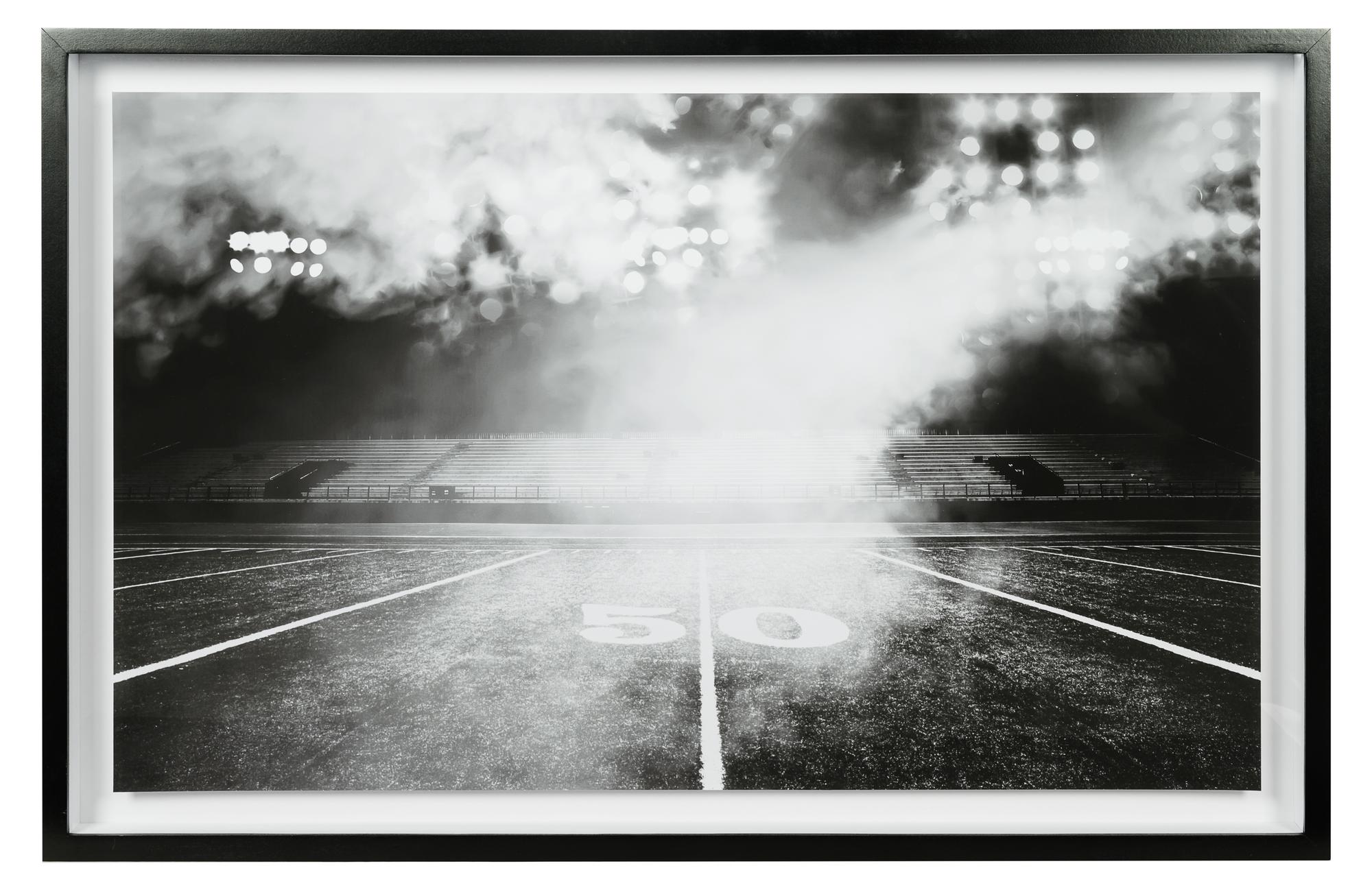 A Group of Four Framed Photographs