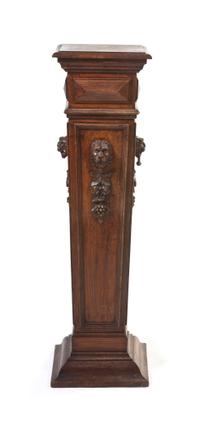 A Neoclassical Carved Oak Pedestal, Height 46 inches.