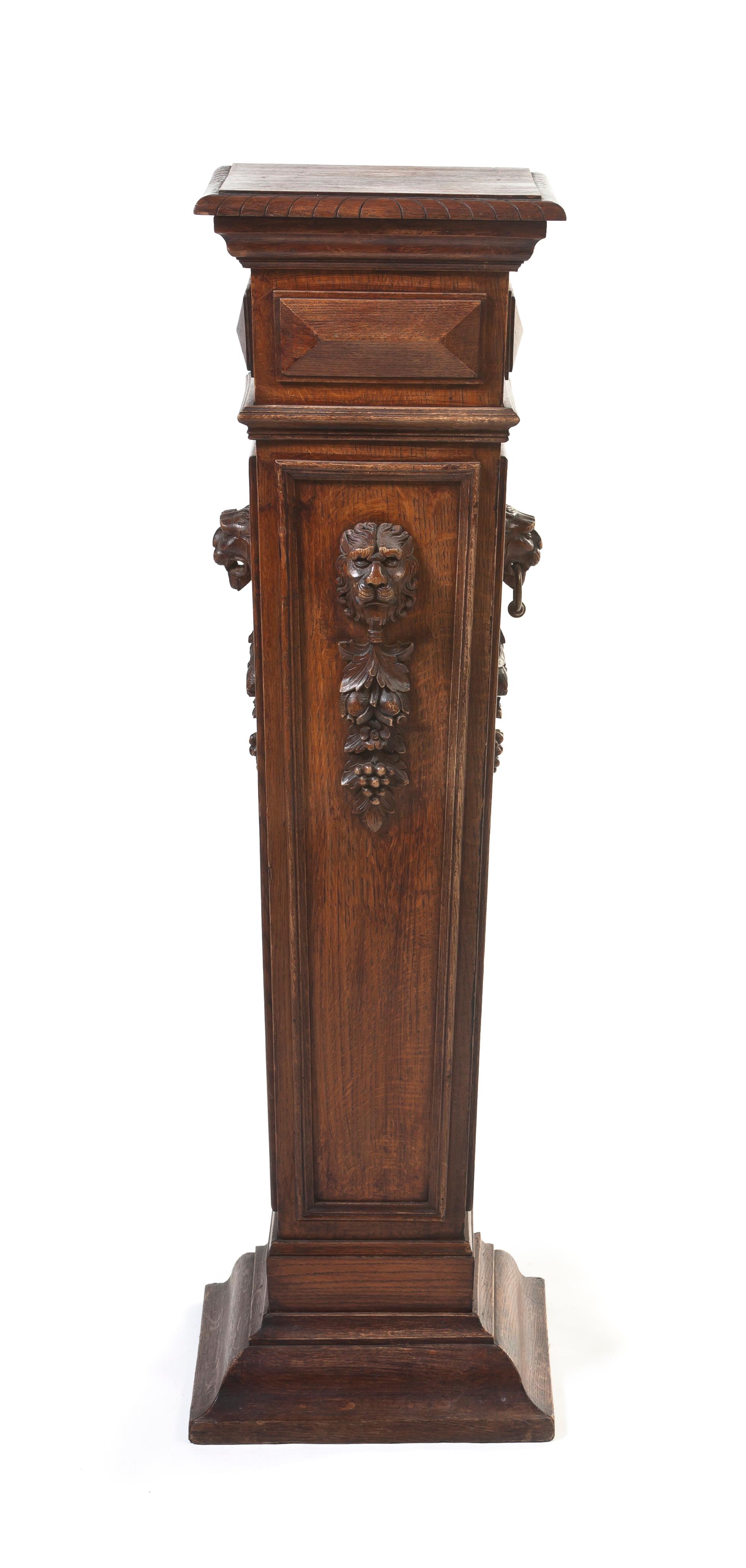 A Neoclassical Carved Oak Pedestal, Height 46 inches.