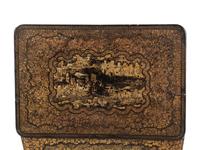 A Chinese Export Gilt and Black Lacquered Sewing Table
