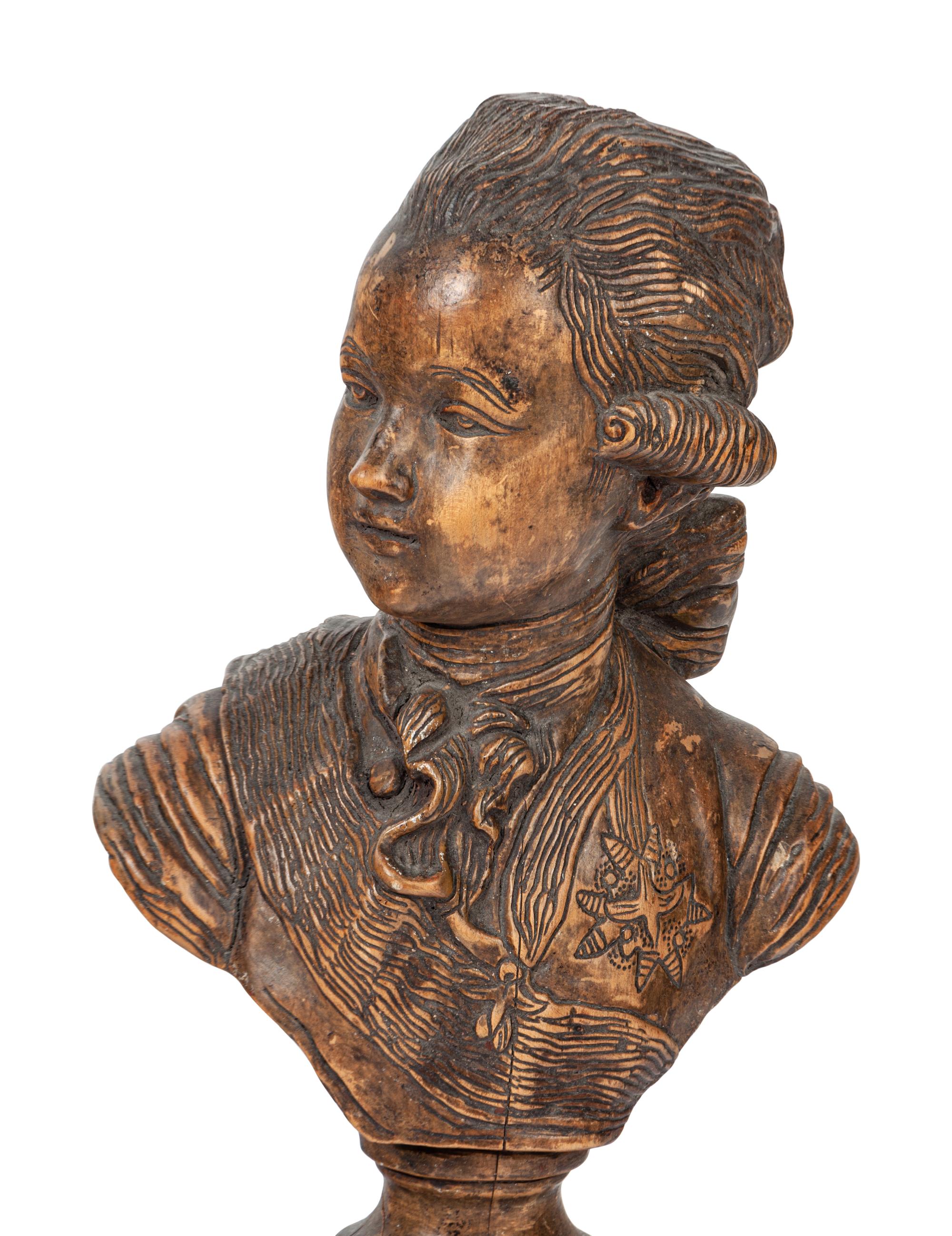 A French Carved Fruitwood Bust of a Young Louis XVI