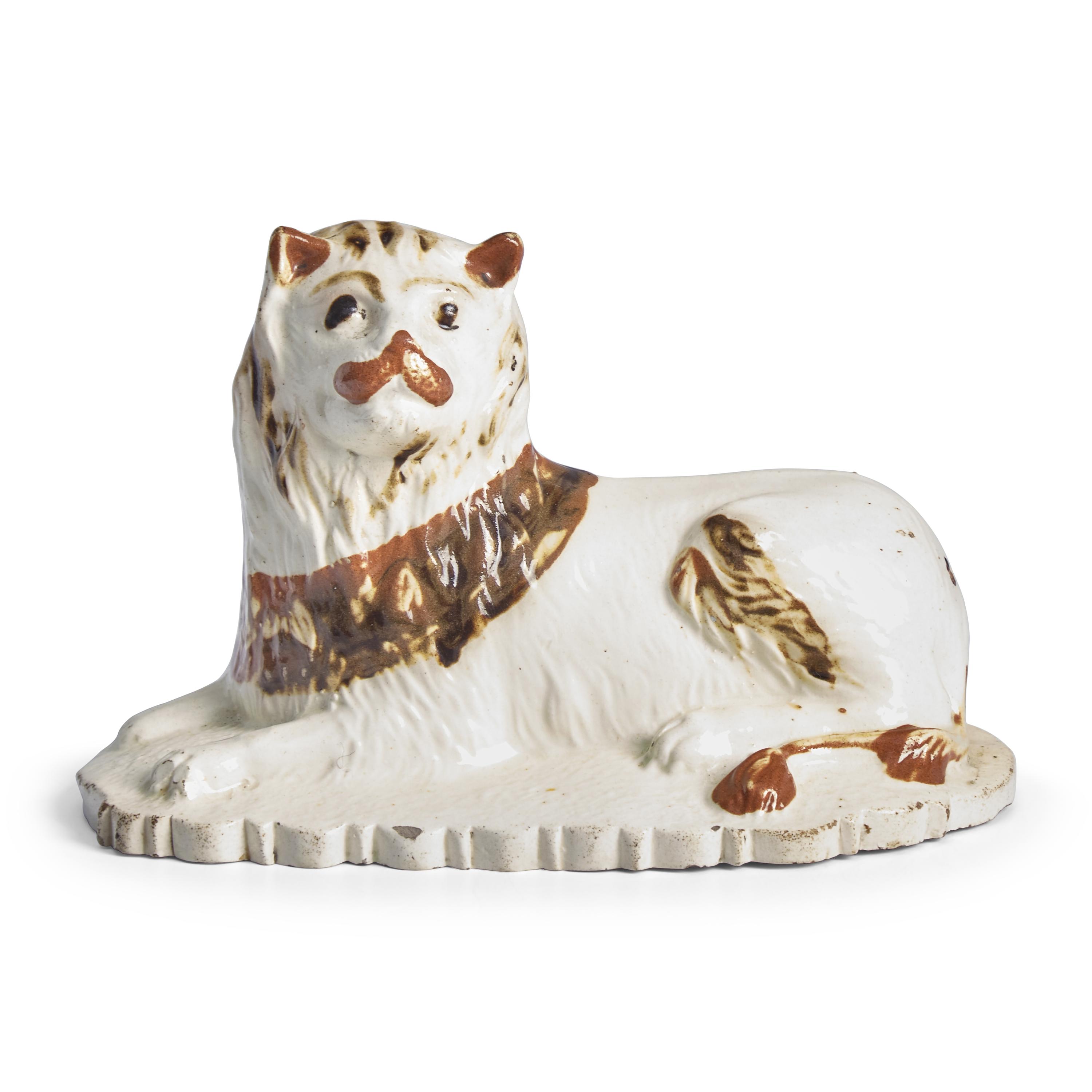 A Creamware Figure of a Seated Lion