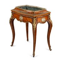 A French Kingwood, Tulipwood, Gilt Bronze and Porcelain Mounted Jardinière Table