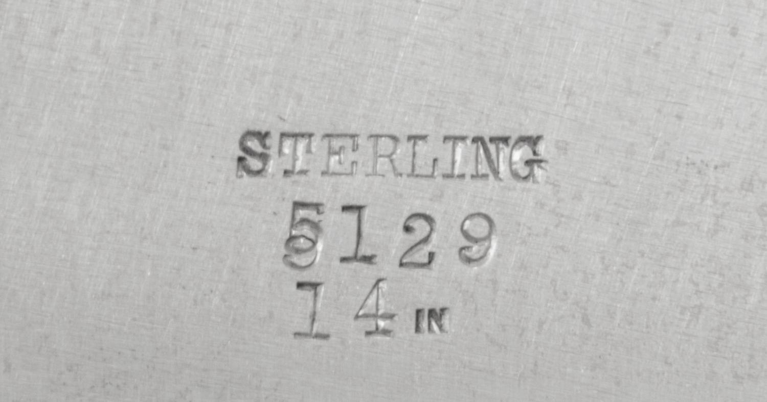 An American Silver Serving Dish, Likely Redlich & Co., New York, NY, the rim worked to show bundled reed and foliate motifs, the border
