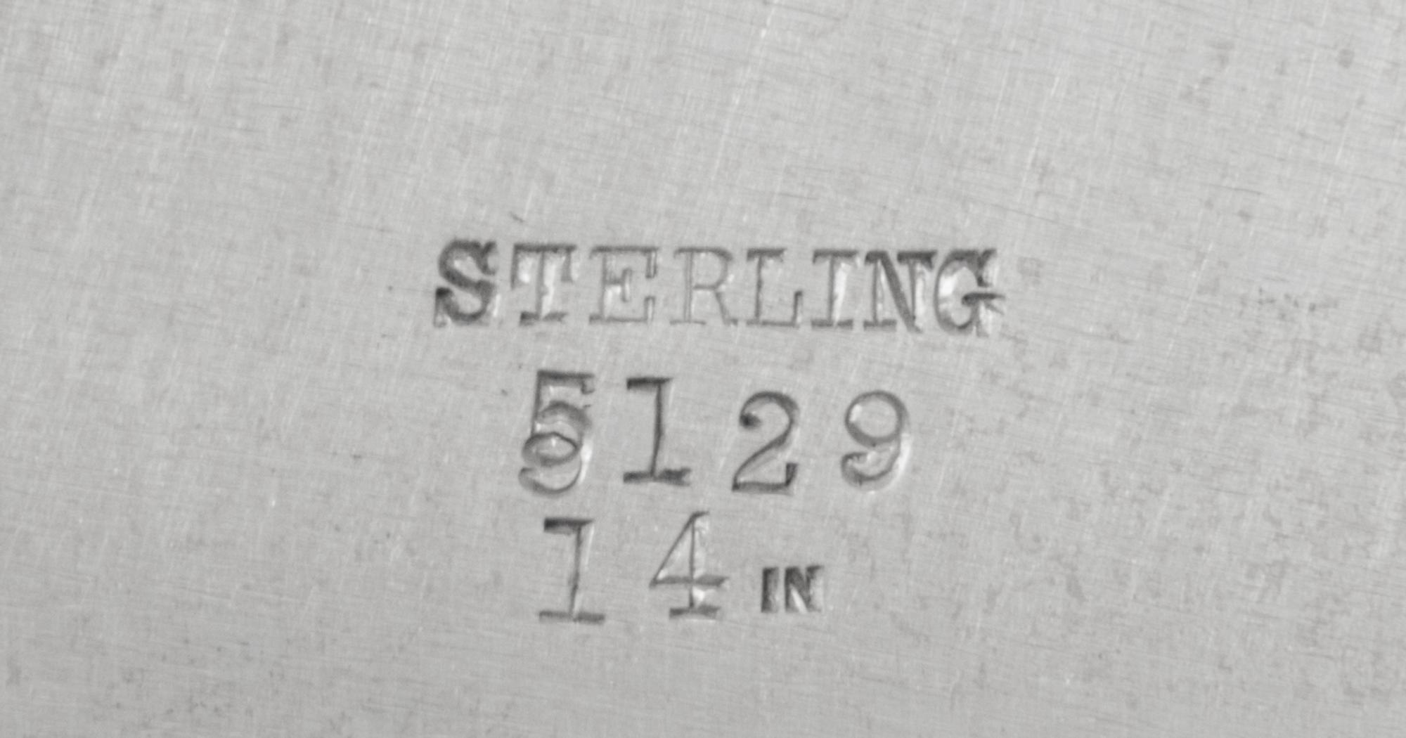 An American Silver Serving Dish, Likely Redlich & Co., New York, NY, the rim worked to show bundled reed and foliate motifs, the border