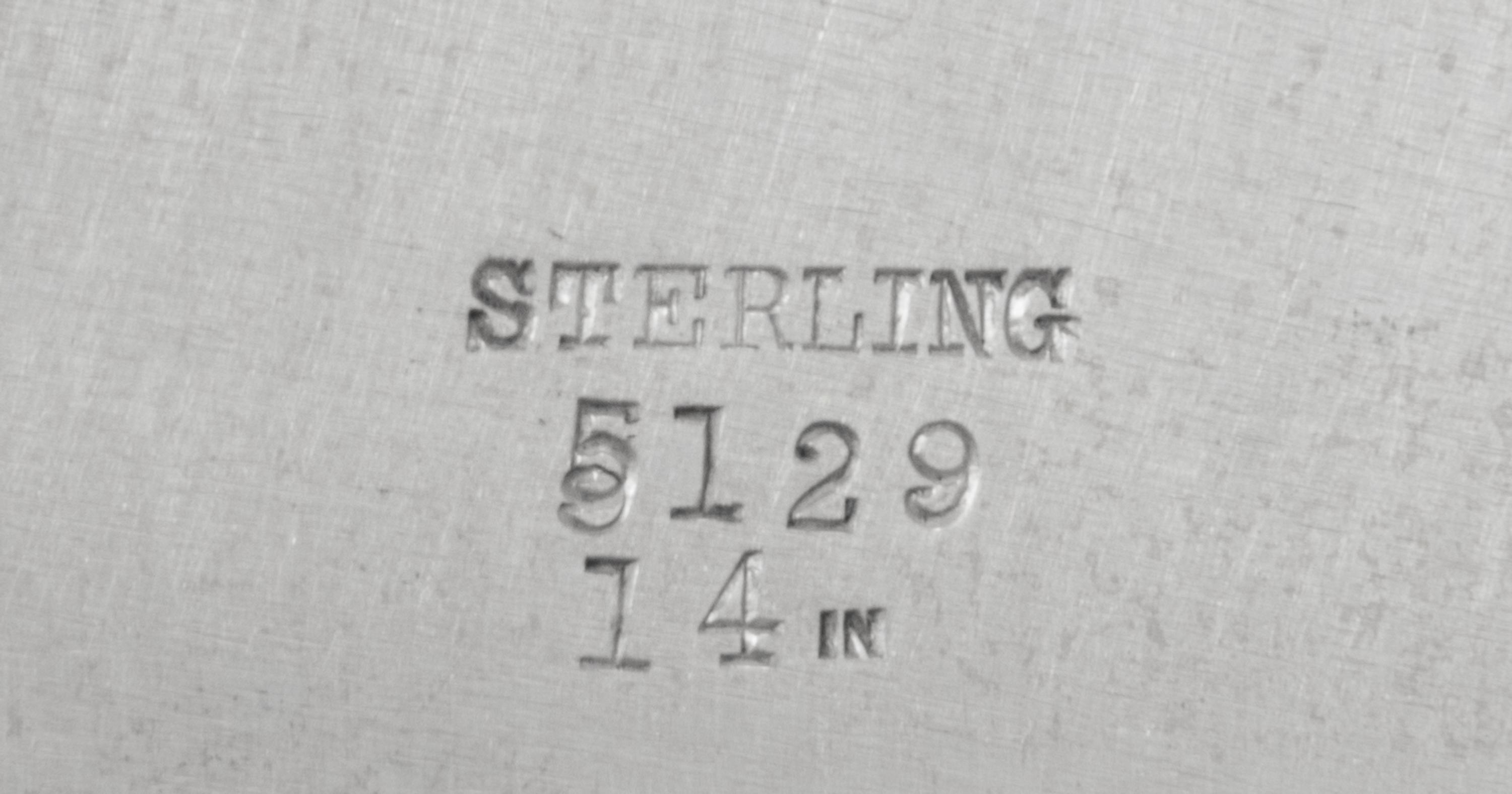 An American Silver Serving Dish, Likely Redlich & Co., New York, NY, the rim worked to show bundled reed and foliate motifs, the border