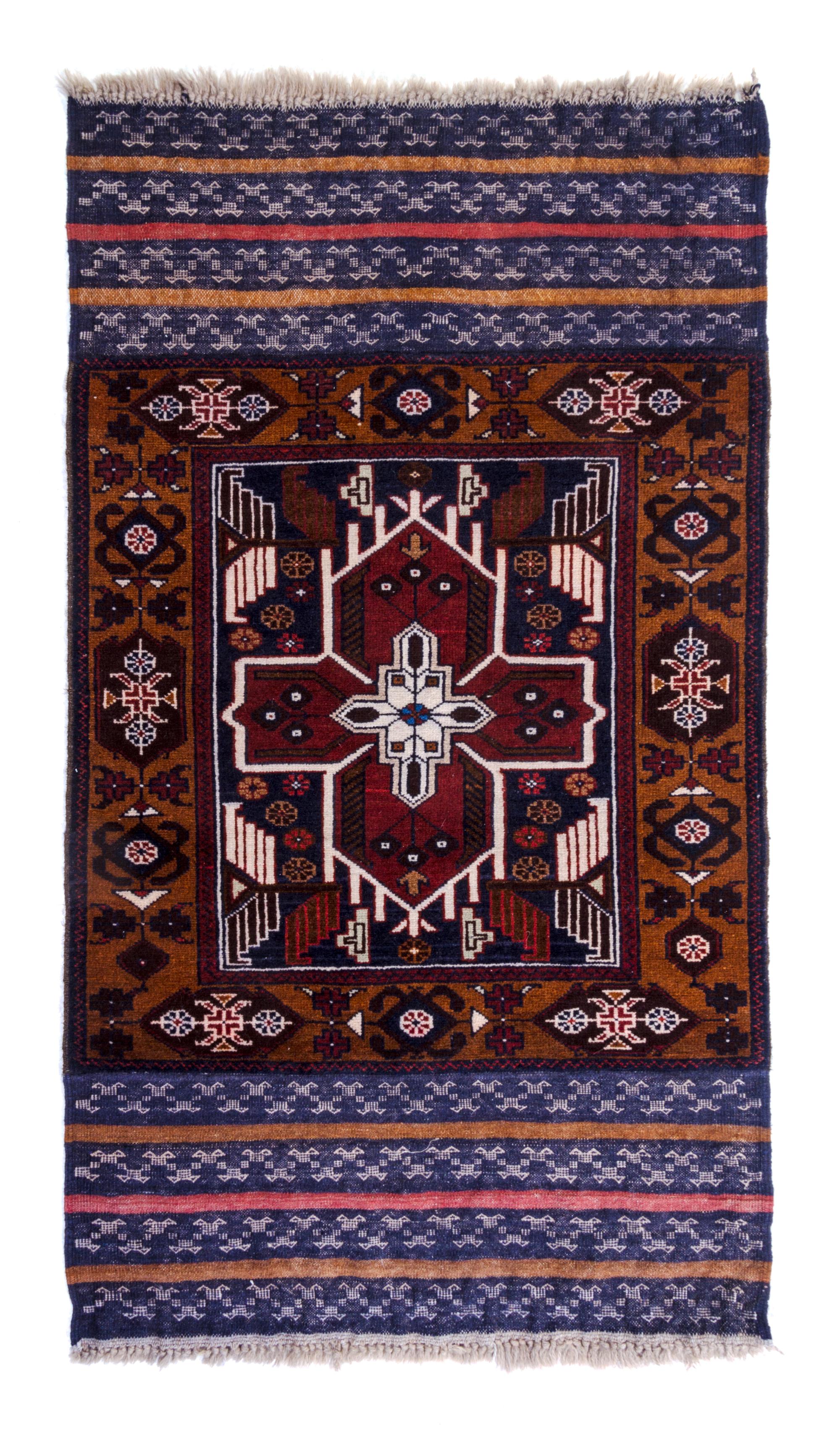An Afghan Wool Rug 4 feet 10 inches x 2 feet 9 1/2 inches.