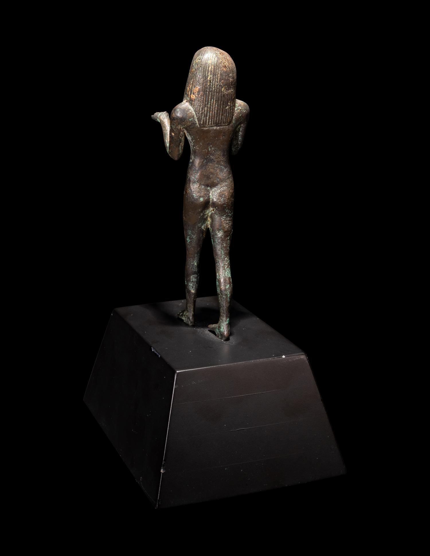 An Egyptian Bronze King or Deity as a Nude Offering-Bearer