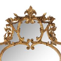 An Italian Rococo Revival Carved Giltwood Mirror