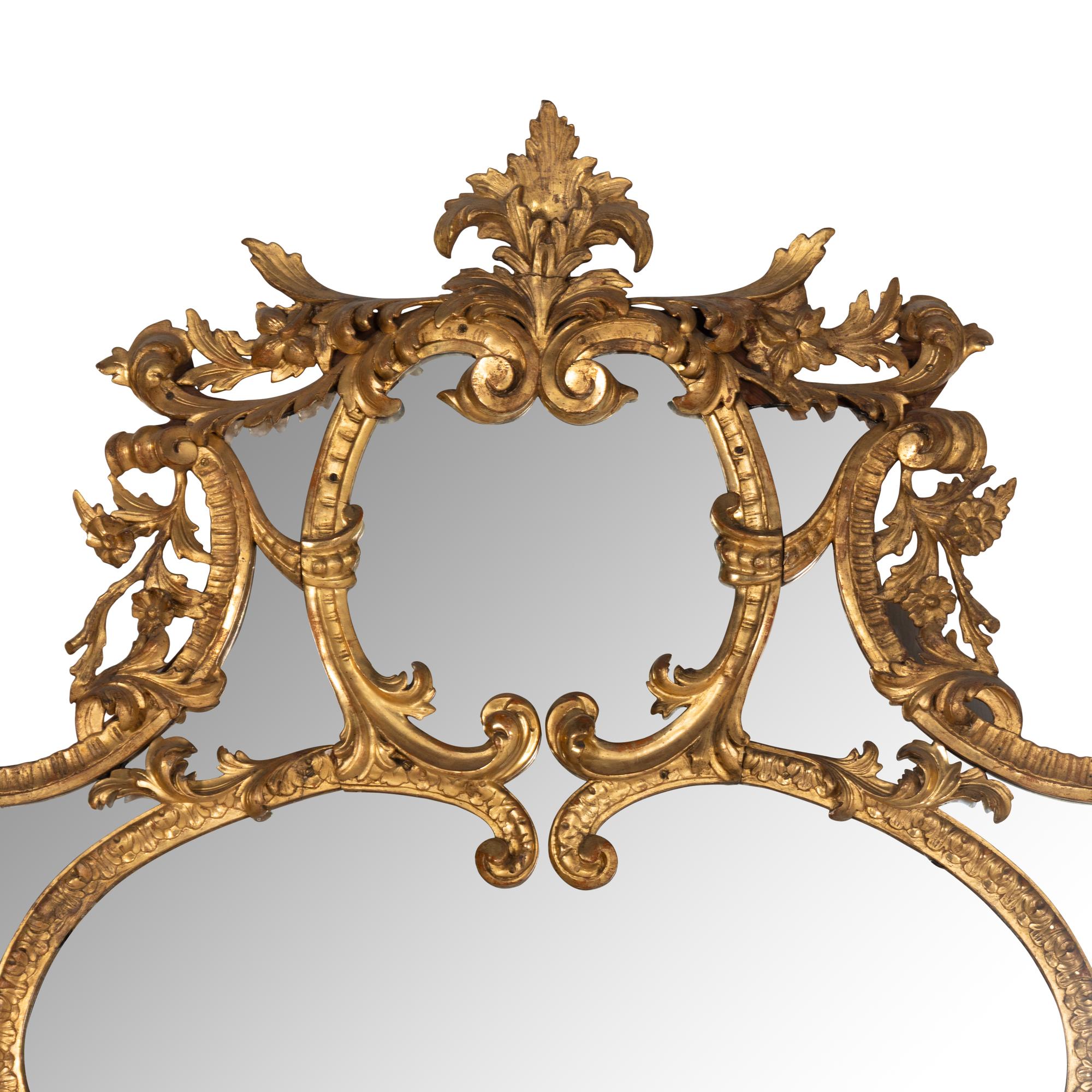 An Italian Rococo Revival Carved Giltwood Mirror