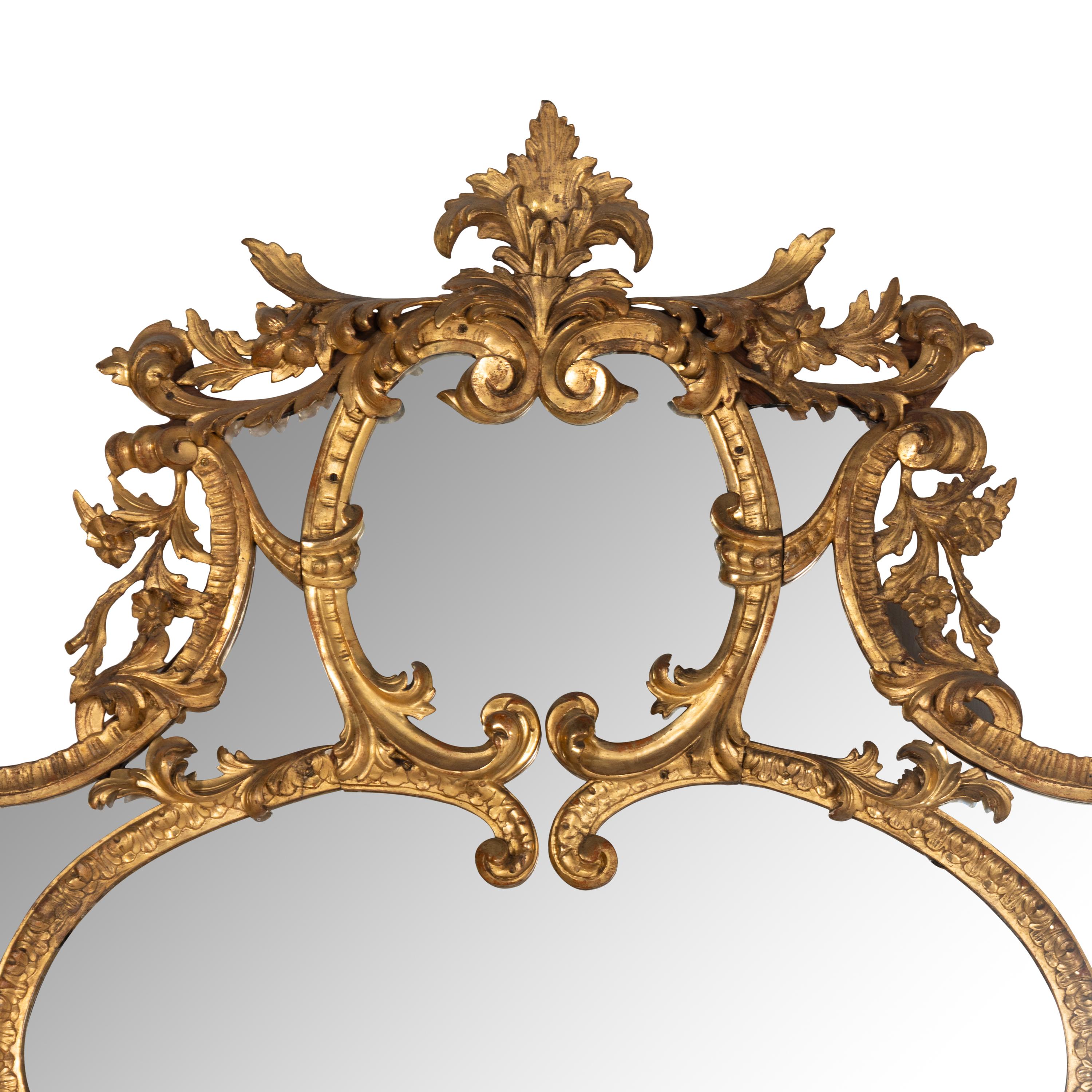 An Italian Rococo Revival Carved Giltwood Mirror