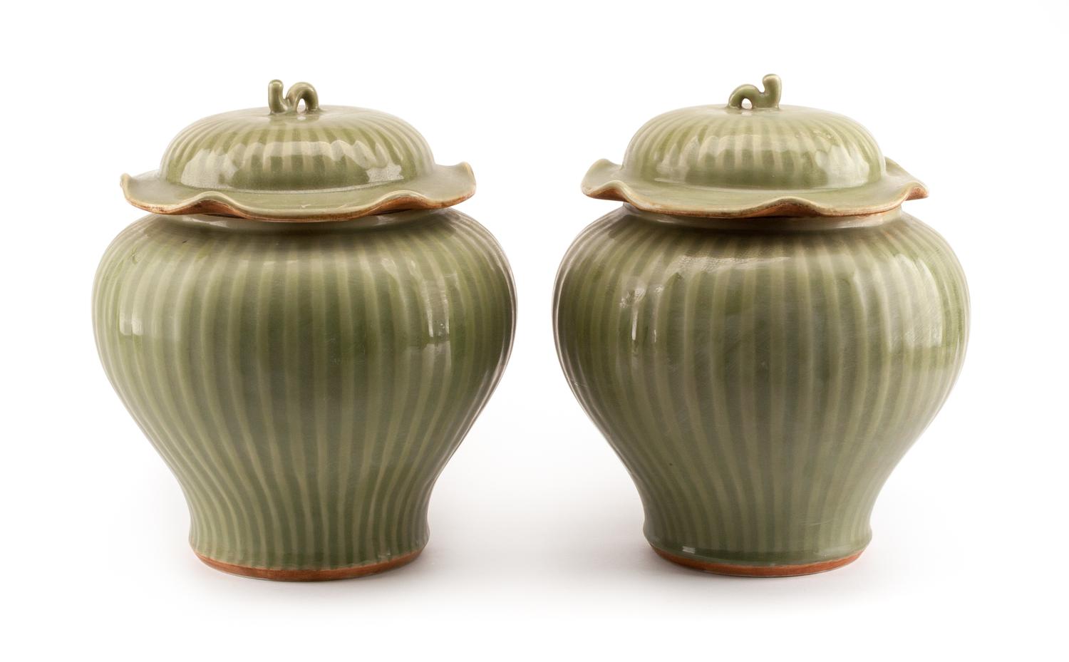A Pair of Chinese Celadon Glazed Covered Vases Height 14 inches.