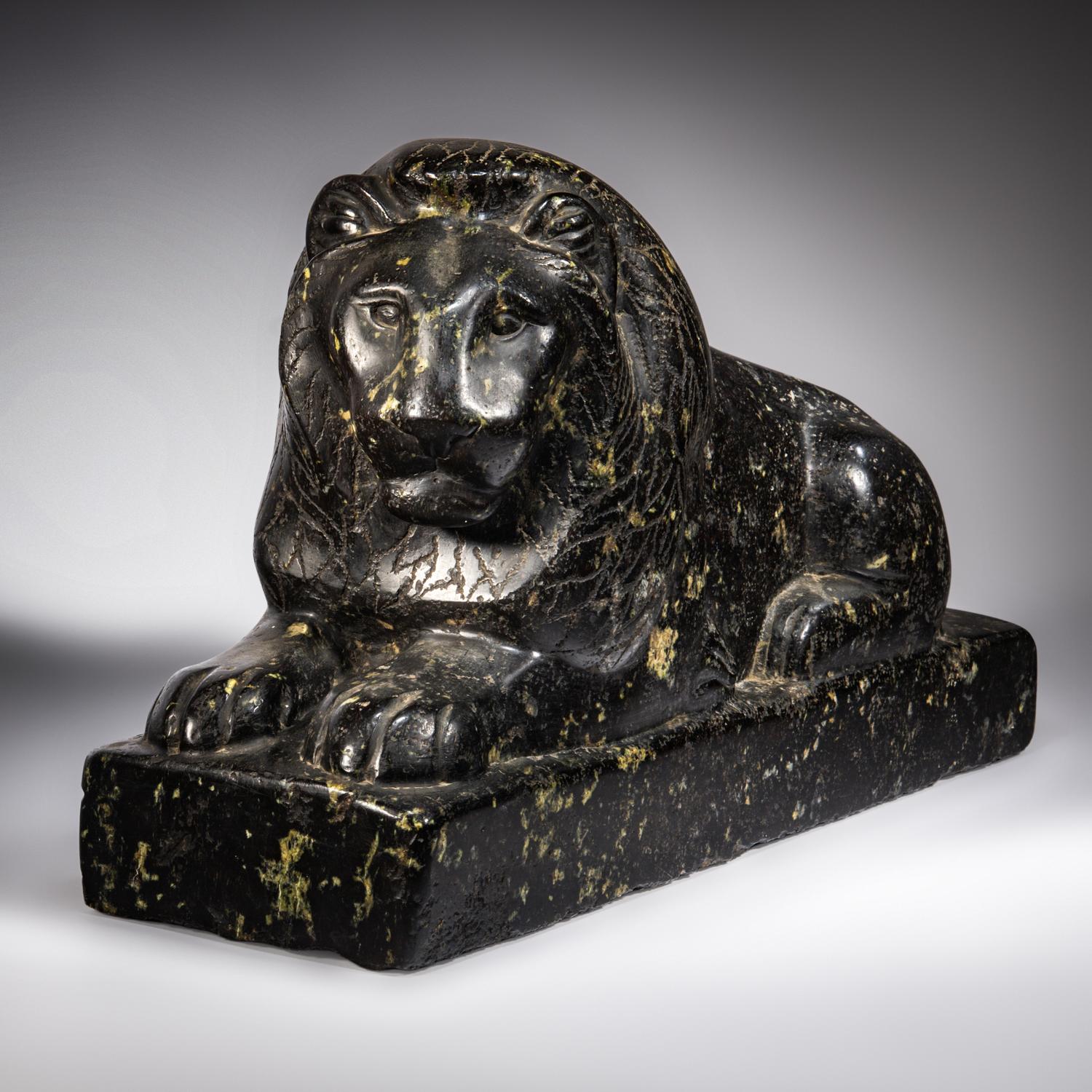 An Egyptian Black Marble Recumbent Lion