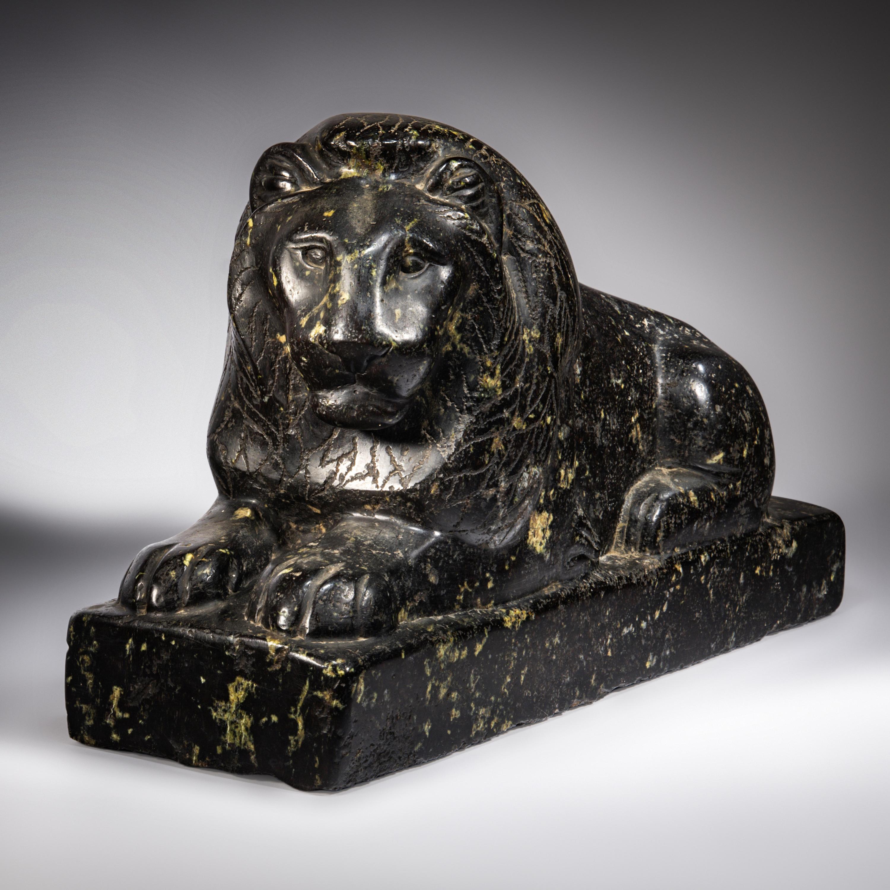 An Egyptian Black Marble Recumbent Lion