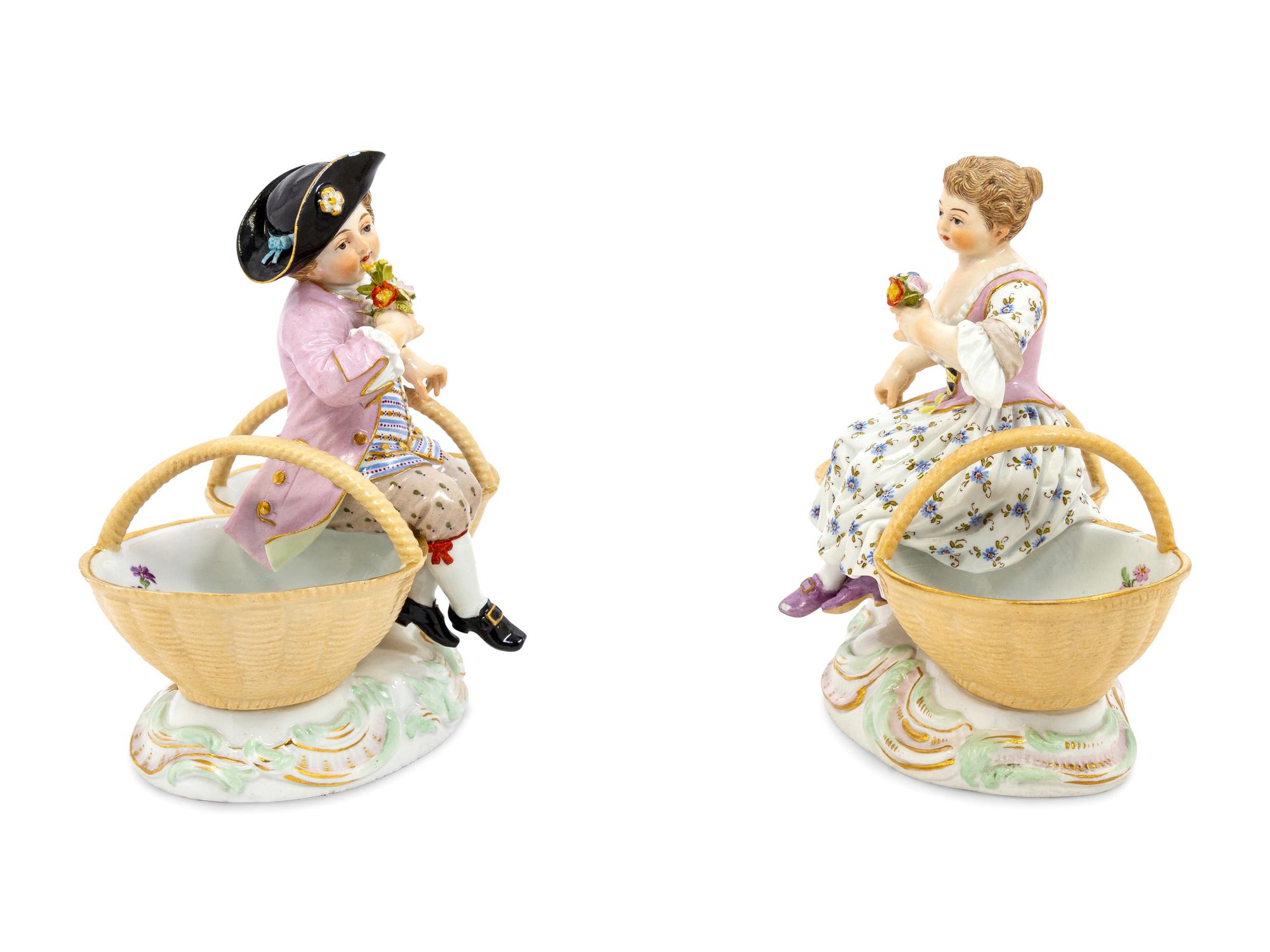 A Pair of Meissen Porcelain Basket Figures