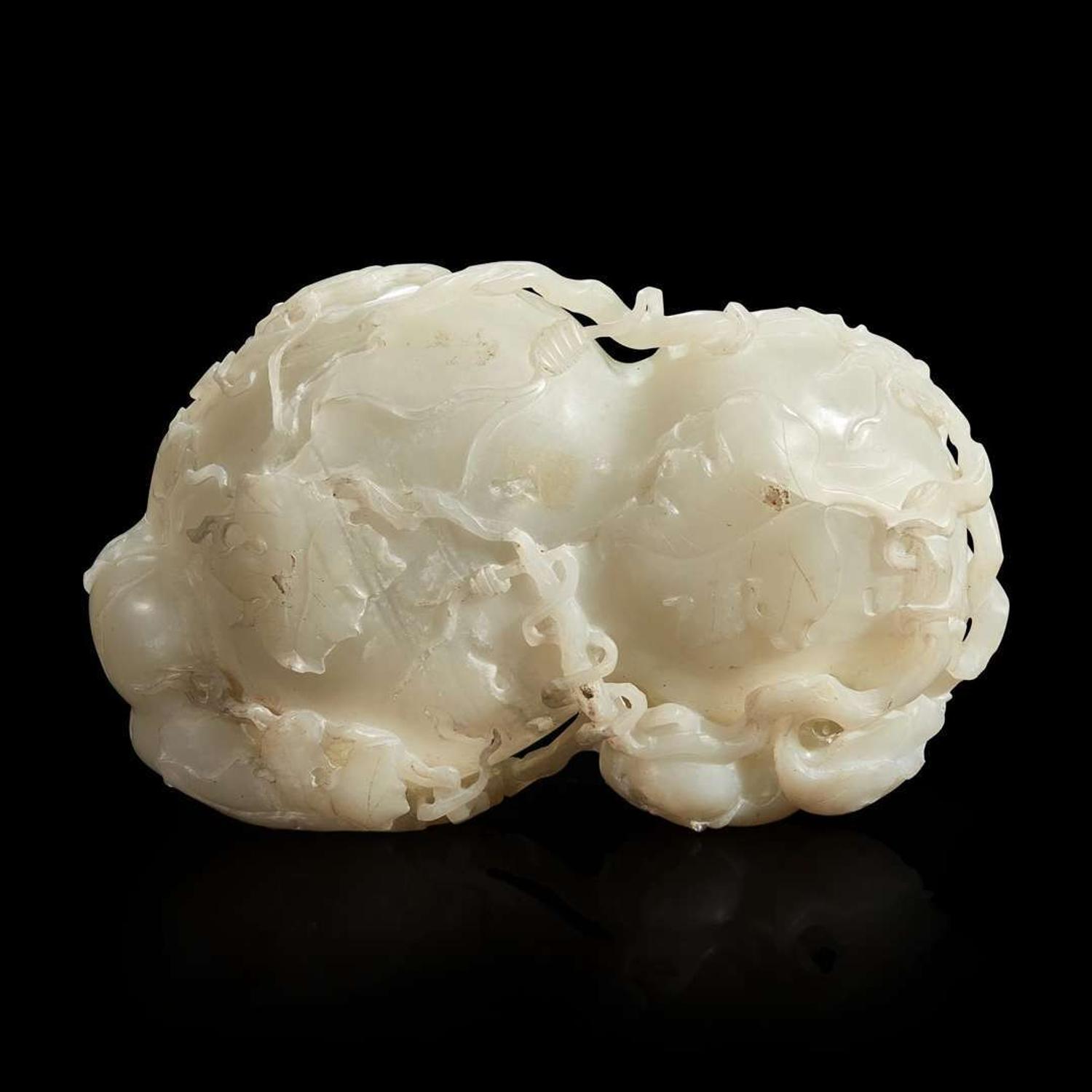 A Chinese carved white jade double-gourd washer with wood stand