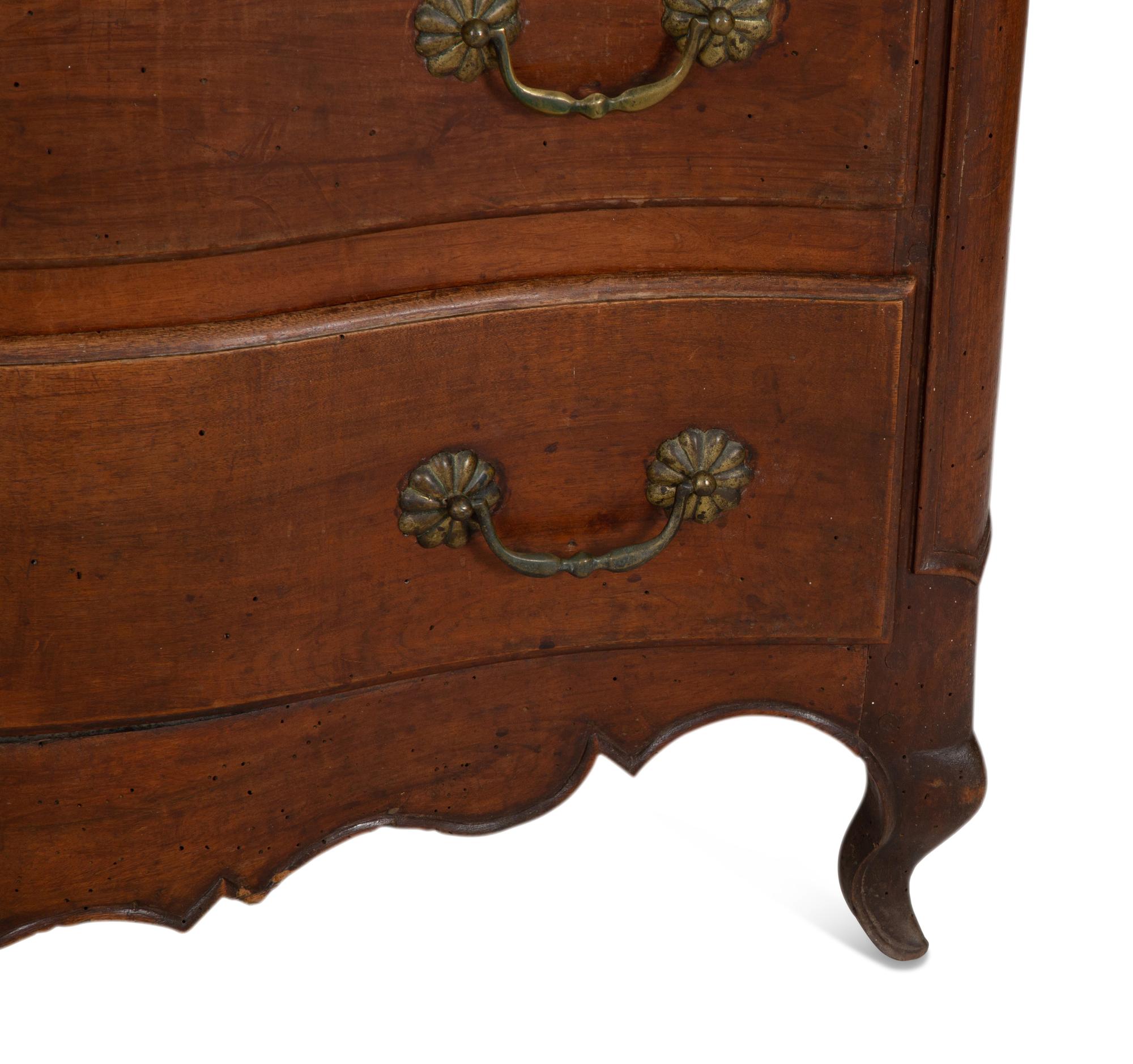 A French Provincial Carved Walnut Commode