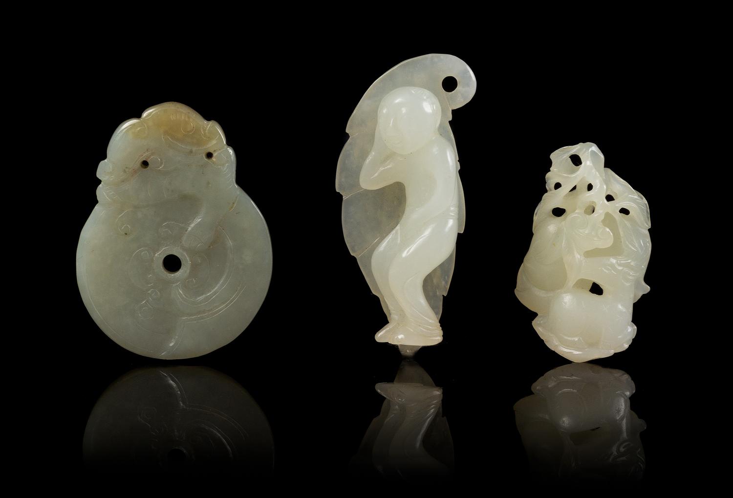 Three Carved Jade Toggles Length 2 1/4 inches.