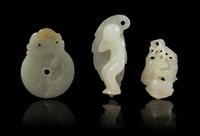 Three Carved Jade Toggles Length 2 1/4 inches.