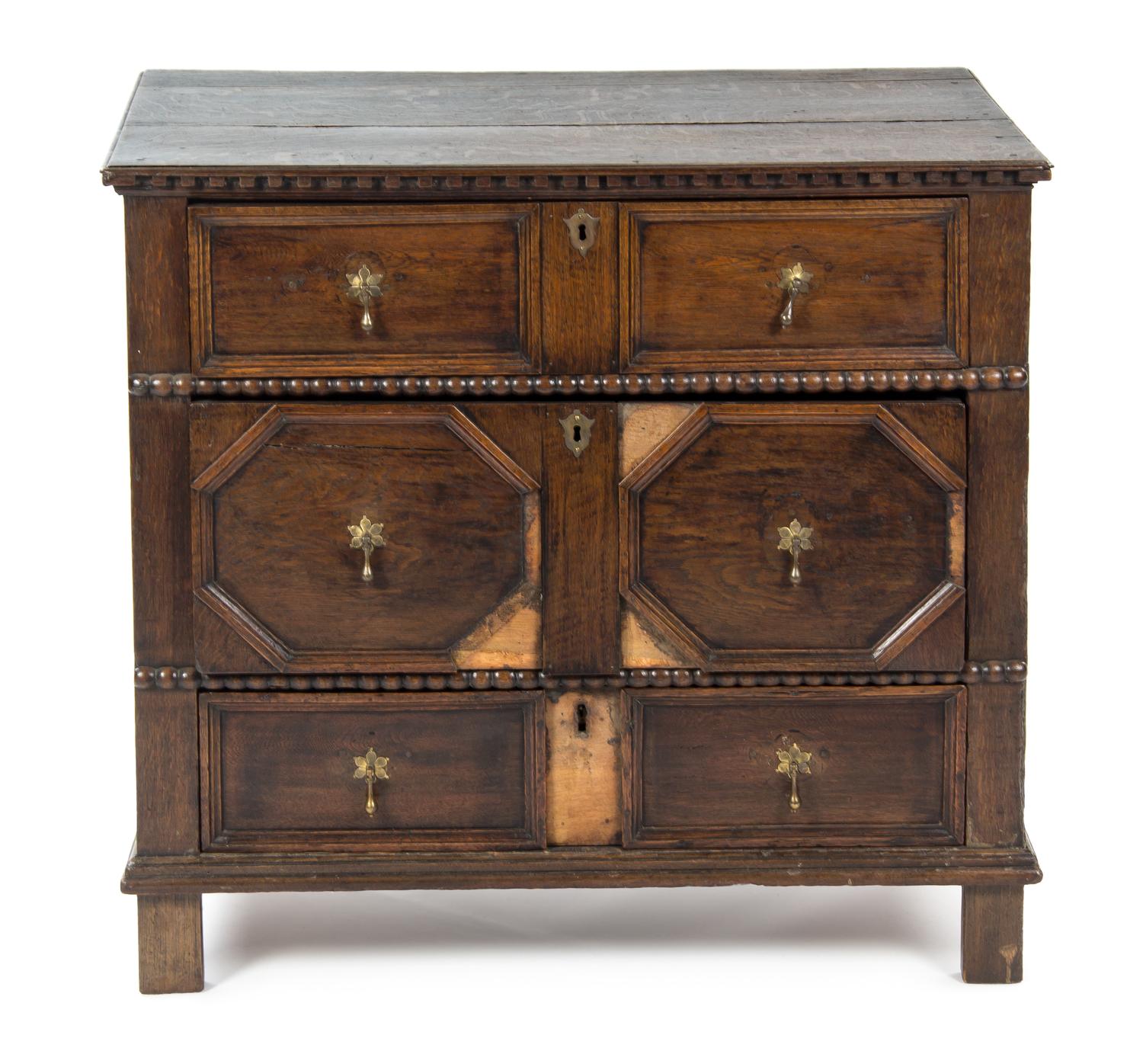 A Baroque Style Oak Chest of Drawers, 17TH CENTURY, Height 33 1/2 inches. — 17TH CENTURY,
