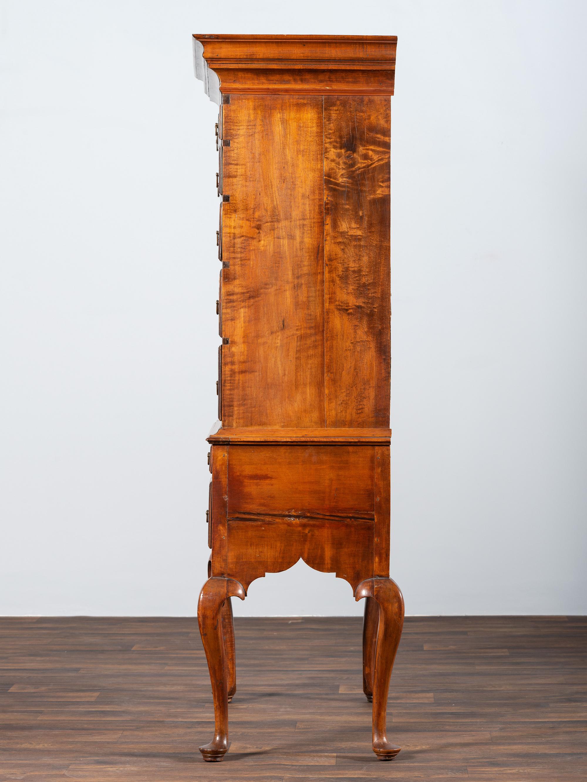 A Queen Anne Shell-Carved and Figured Maple Flat-Top High Chest of Drawers
