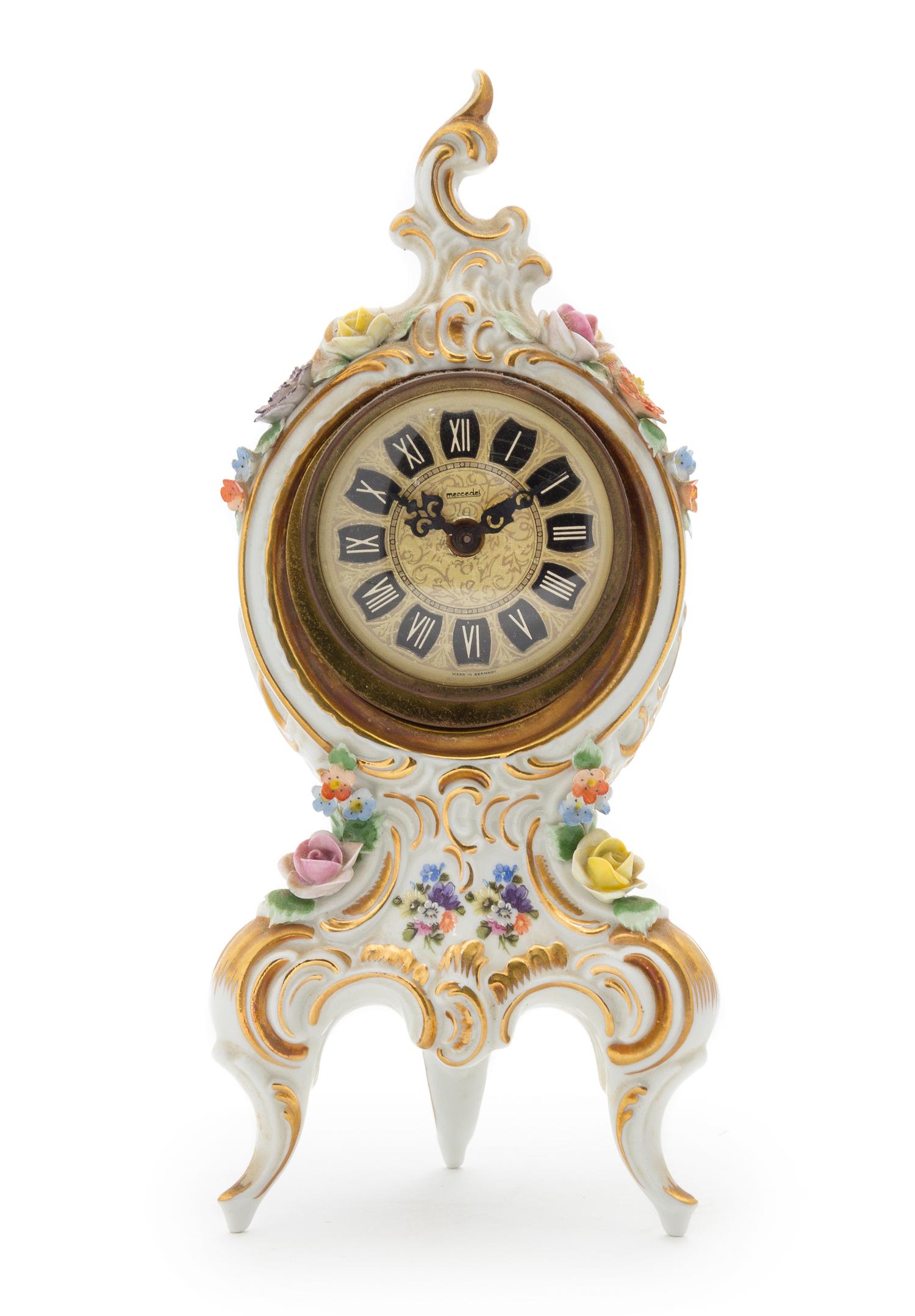 A Dresden Porcelain Desk Clock Height 9 1/8 inches.