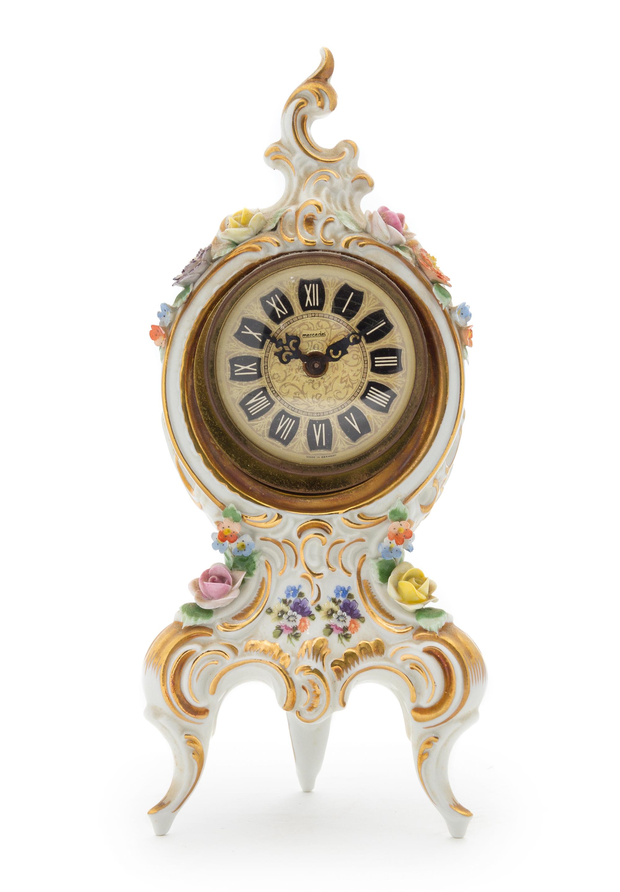 A Dresden Porcelain Desk Clock Height 9 1/8 inches.