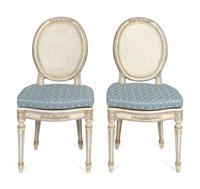 A Pair of Louis XVI Style White-Painted and Caned Chaises